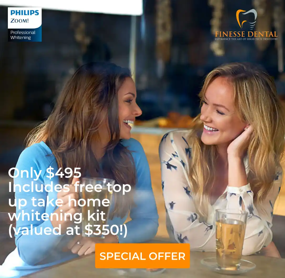 Two women promoting a dental whitening offer for $495 including a free top-up kit
