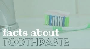 toothpaste-facts Colorful toothbrush on a bathroom counter with bold text saying 'facts about TOOTHPASTE