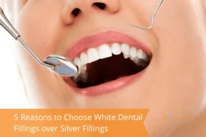 Close-up of a smiling person receiving a dental check-up with a mirror tool