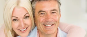 The woman has her arm around the man