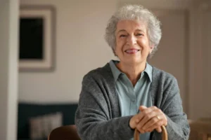 Senior dental care an elderly woman with a radiant, warm smile in a brightly lit setting