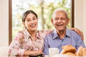 Family dental care for all ages a young woman and an older man sharing a warm smile