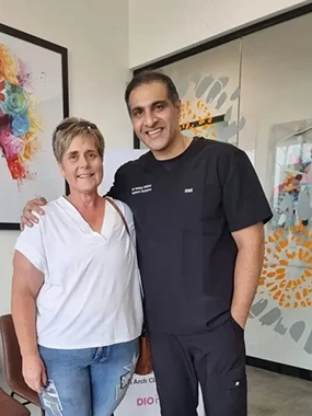 A woman in a white t-shirt pictured together with Dr Sehmi