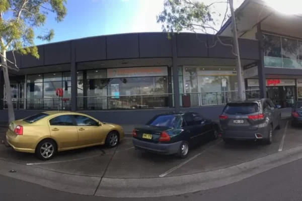 Cars are parked in front of Finesse Dental Clinic