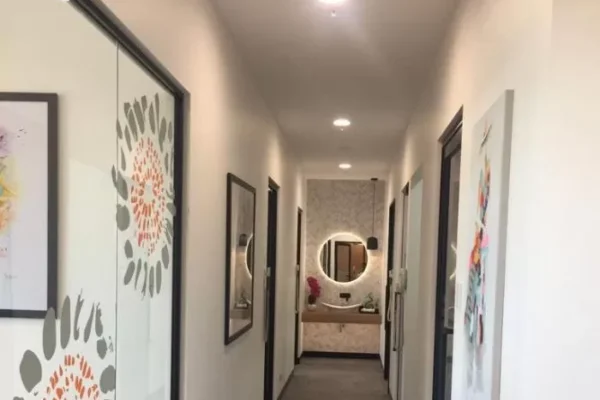 Showing treatment room doors and a stylish vanity area
