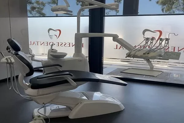 Clinic treatment room featuring a professional dental chair