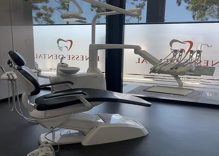 Clinic treatment room featuring a professional dental chair