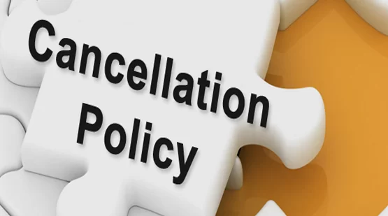 A white puzzle piece with "Cancellation Policy" in bold black letters fits into a larger puzzle against an orange background, conveying organization and clarity